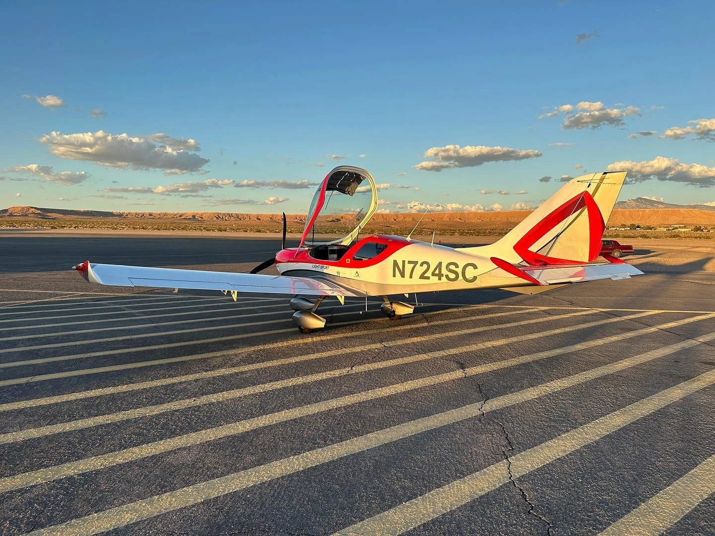 Training aircraft on the runway at golden hour