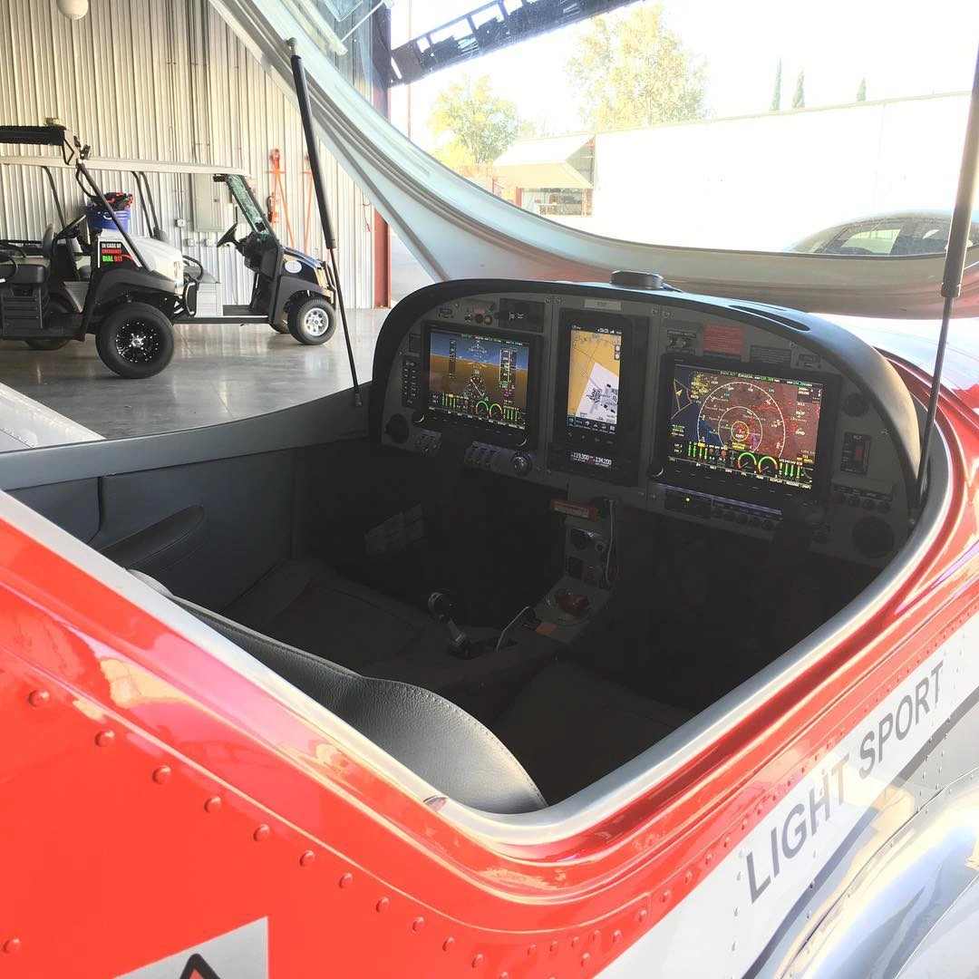 View of the modern glass cockpit screens from the pilot seat